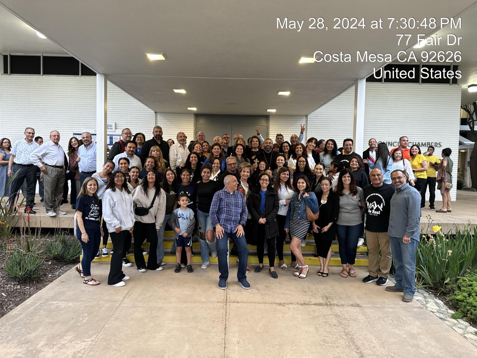 The congregation gathered and smiling on the steps of the Costa Mesa council chambers, minutes after the approval